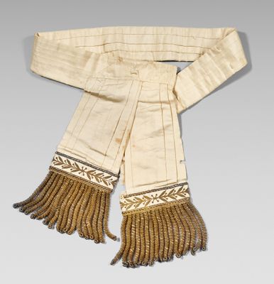 an image of a white scarf with fringes on it