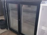 two glass doors on the side of a refrigerator