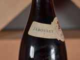 a bottle of wine that is sitting on a table
