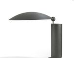 a close up of a table lamp on a white surface