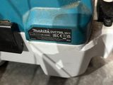 a blue and white machine that is sitting on the floor