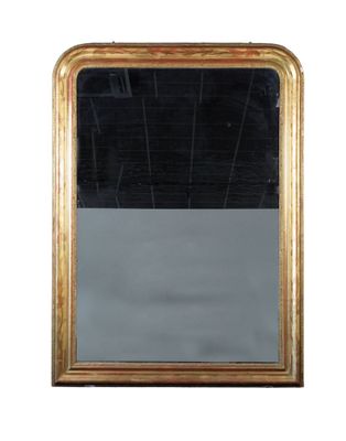 une image d'un miroir encadré d'or sur un mur blanc