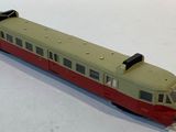 a toy train that is sitting on a white surface