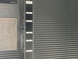 an image of a closed garage door with a sign on it