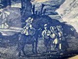 a blue and white drawing of a man on a horse