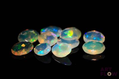 some very pretty white oplites on a black surface