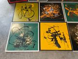 many different colored paintings on the floor next to each other
