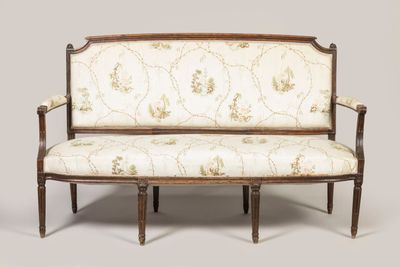 an image of a settee with a floral upholstered back