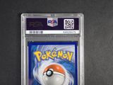 a close up of a pokemon trading card on a table
