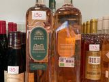 several bottles of alcohol are lined up on a counter