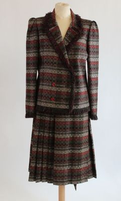 an image of a dress and coat on a mannequin mannequin