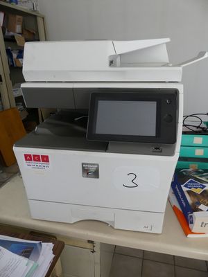 a printer sitting on a table in a room