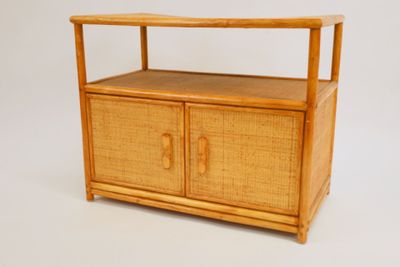 a wooden cabinet with a shelf on top of it