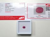 a pink diamond in a white box on a table