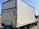 a white truck that is parked on the side of the road