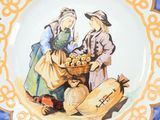 a plate with a picture of two people on it