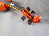 a violin that has been left on the floor