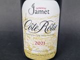 a bottle of wine that is sitting on a table