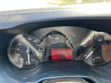 a close up of a car dashboard with a clock on it