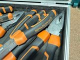 a bunch of tools in a tool case on the floor