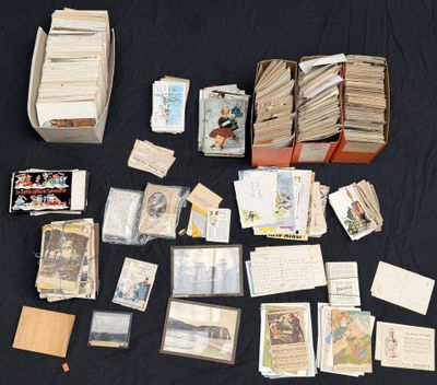 a lot of cards and a box of books on a table