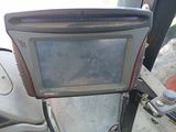 a picture of a monitor mounted on the back of a tractor