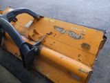 a yellow machine that is sitting on the side of the road