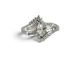 a close up of a diamond ring on a white background