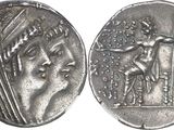 a close up of a silver coin with a man on it
