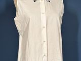 this image may contain a mannequin and a shirt on a mannequin stand
