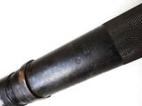 a close up of a metal pipe on a white surface