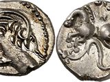 a silver coin with an image of a horse on it