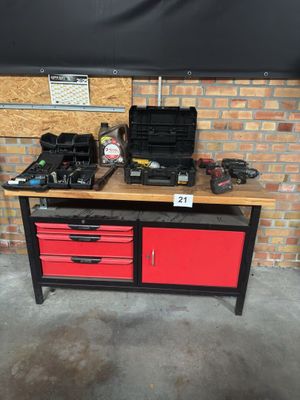 a workbench with tools on top of it in a garage
