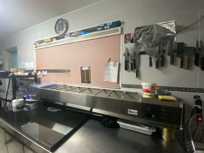 an image of a commercial kitchen with stainless steel counter tops