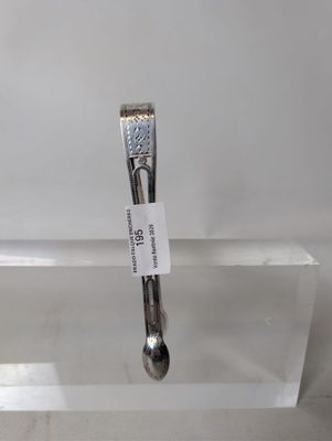 a silver spoon and a silver spoon on a clear plate