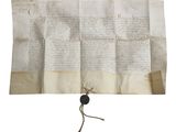 un morceau de papier portant un cachet de cire