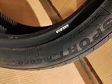 tire on a cardboard box with a wooden floor in the background