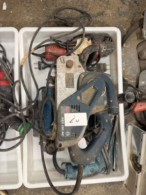 a box full of tools that are sitting on the floor