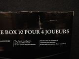 a box of four jouers sitting on a table