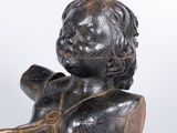 statue of a child holding a pipe on a white background