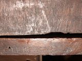 a close up of a wooden door with a hole in it