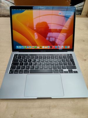 an apple macbook pro laptop computer sitting on top of a wooden table