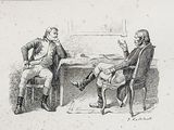 two men sitting at a table talking to each other