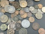 a lot of coins that are on the table