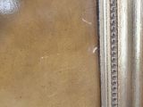 a close up of a picture of a painting on the wall