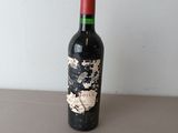 a bottle of wine that is sitting on a table