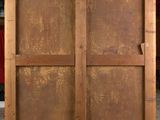 an image of an old wooden door with a handle on it