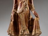 bronze statue of a standing buddha holding a bowl of water