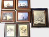 many framed pictures of ships on the wall