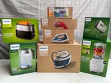 several boxes of philips appliances are stacked on top of each other